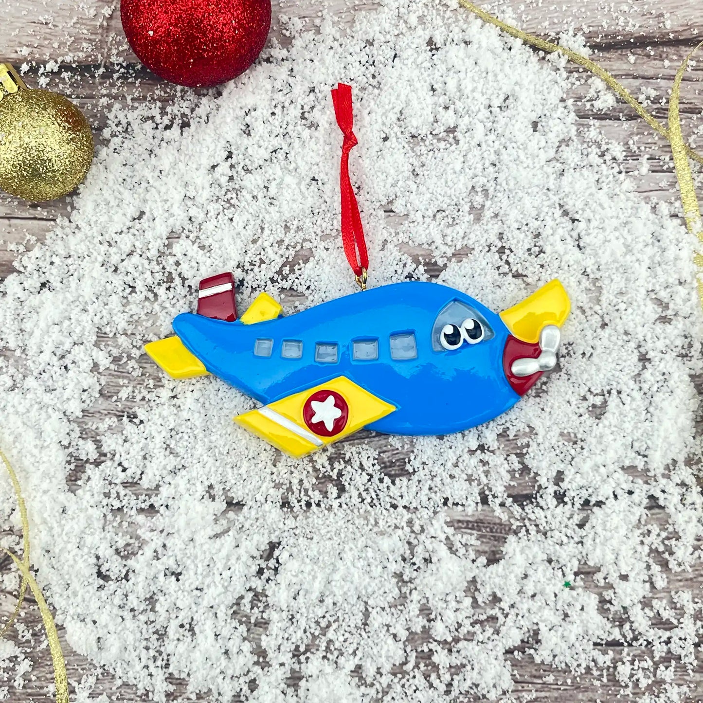 Adorno navideño de avión azul 