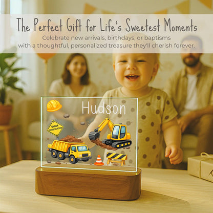 Personalized construction truck night light displayed at birthday celebration, custom name on acrylic plate, gift for toddler boys, ships within 24 hours