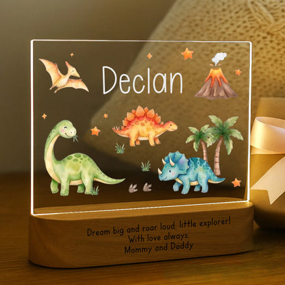 Close-up of child's name Declan laser engraved in white on personalized dinosaur night light acrylic plate