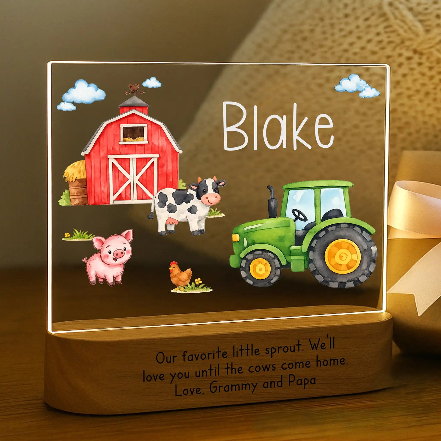 Personalized farm night light glowing with custom name Blake laser engraved on acrylic and Our Favorite Little Sprout message laser engraved on acacia wood base