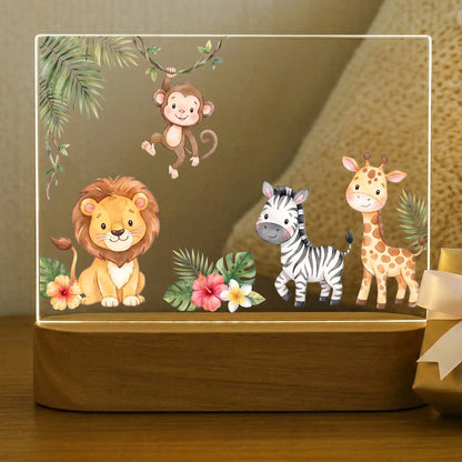 Personalized safari animals night light for kids with lion, monkey, zebra, and giraffe on an acacia wood base