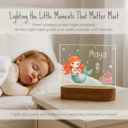 Personalized mermaid night light on nightstand beside sleeping child, 7 soft LED colors and 3 effects, custom name Maya glowing on mermaid seahorse coral ocean design