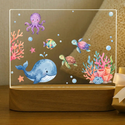 Personalized ocean night light for kids with whale, octopus, sea turtles, and coral reef on an acacia wood base