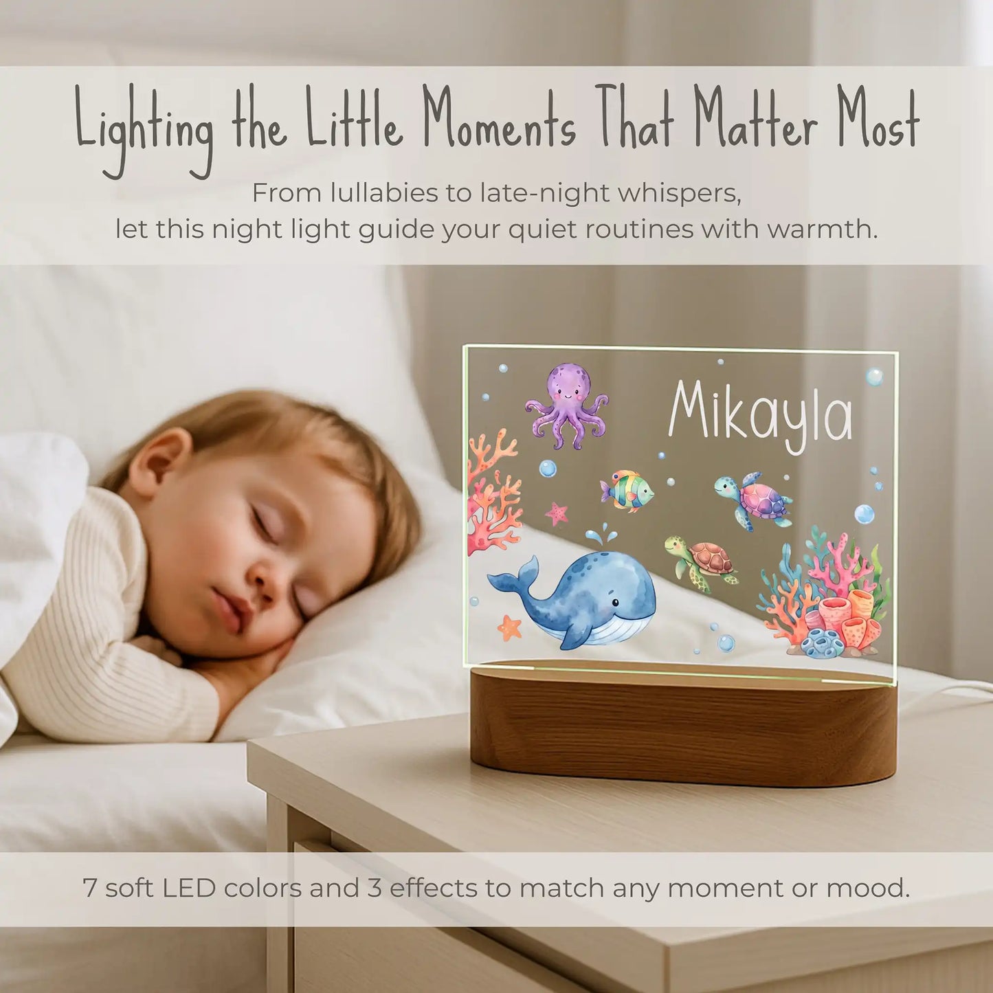 Personalized ocean night light lit on a nightstand beside a sleeping child with 7 LED color options