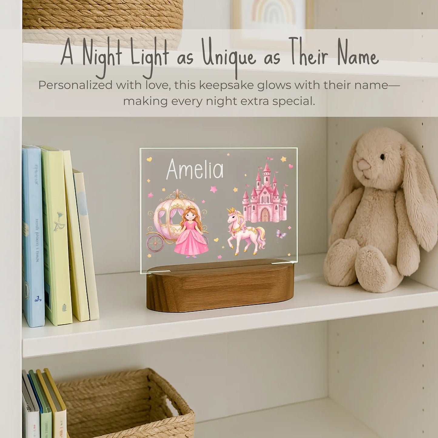 Custom name princess night light on girls bookshelf, acrylic plate with princess unicorn and castle design, name Amelia laser engraved, warm LED glow on acacia wood base