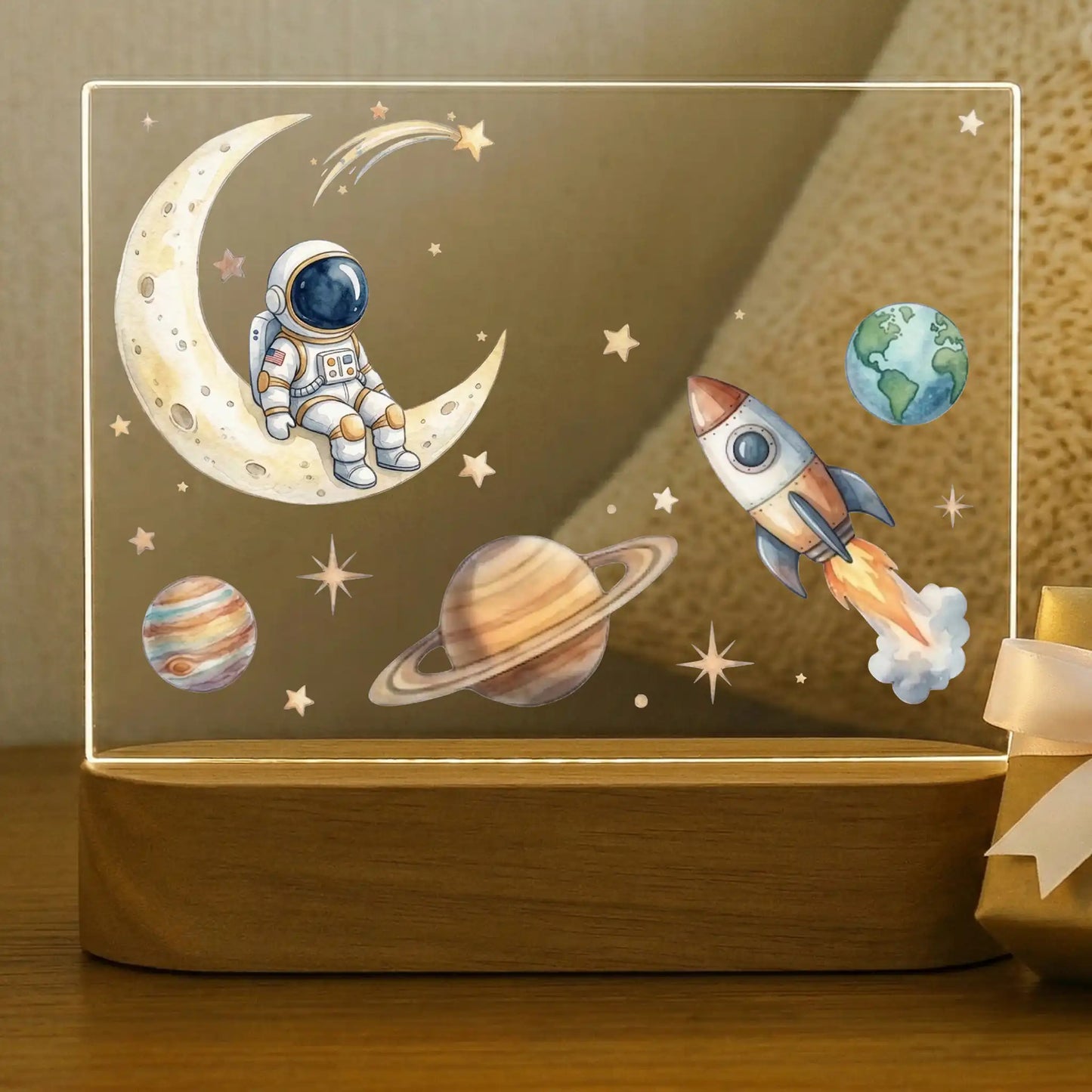 Personalized space night light for kids with astronaut on moon, rocket, Earth, Saturn, and Jupiter on an acacia wood base