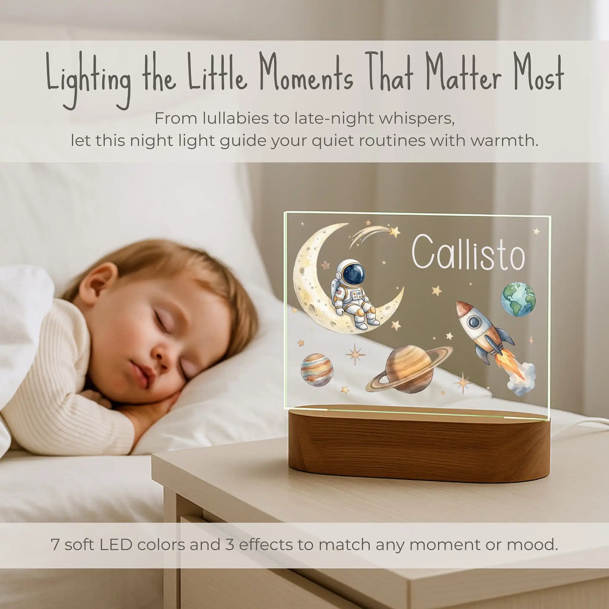 Personalized space night light lit on a nightstand beside a sleeping child with 7 LED color options