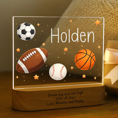 Personalized sports night light glowing with custom name Holden on acrylic and Dream Big Aim High message laser engraved on acacia wood base