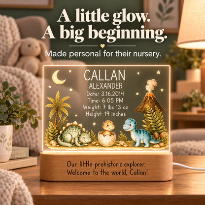 Dinosaur birth stats night light glowing on a nursery shelf