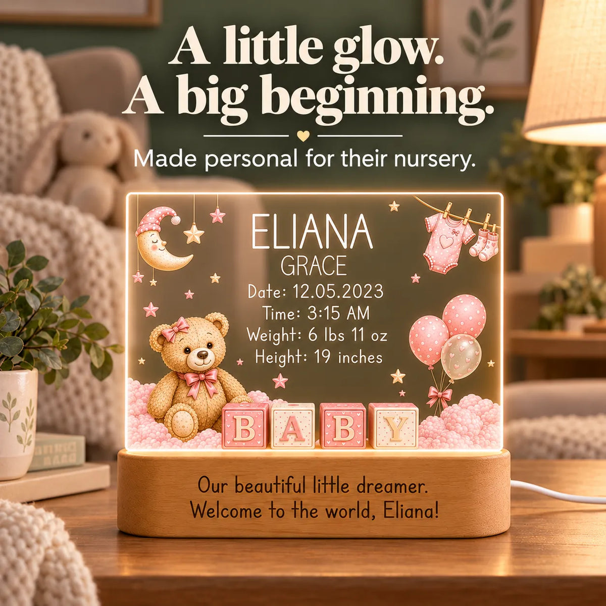 Pink teddy bear birth stats night light glowing on a nursery shelf
