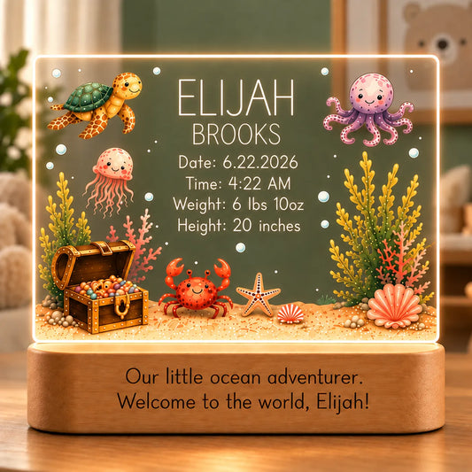 Personalized ocean baby night light with birth stats, sea turtle, octopus and treasure chest artwork, and engraved message on an acacia wood LED base