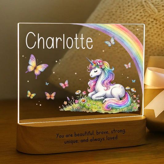 Personalized unicorn night light glowing with custom name Charlotte laser engraved on acrylic and You Are Beautiful Brave Strong message laser engraved on acacia wood base