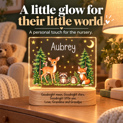 Personalized woodland animals night light glowing on a dresser in a cozy nursery