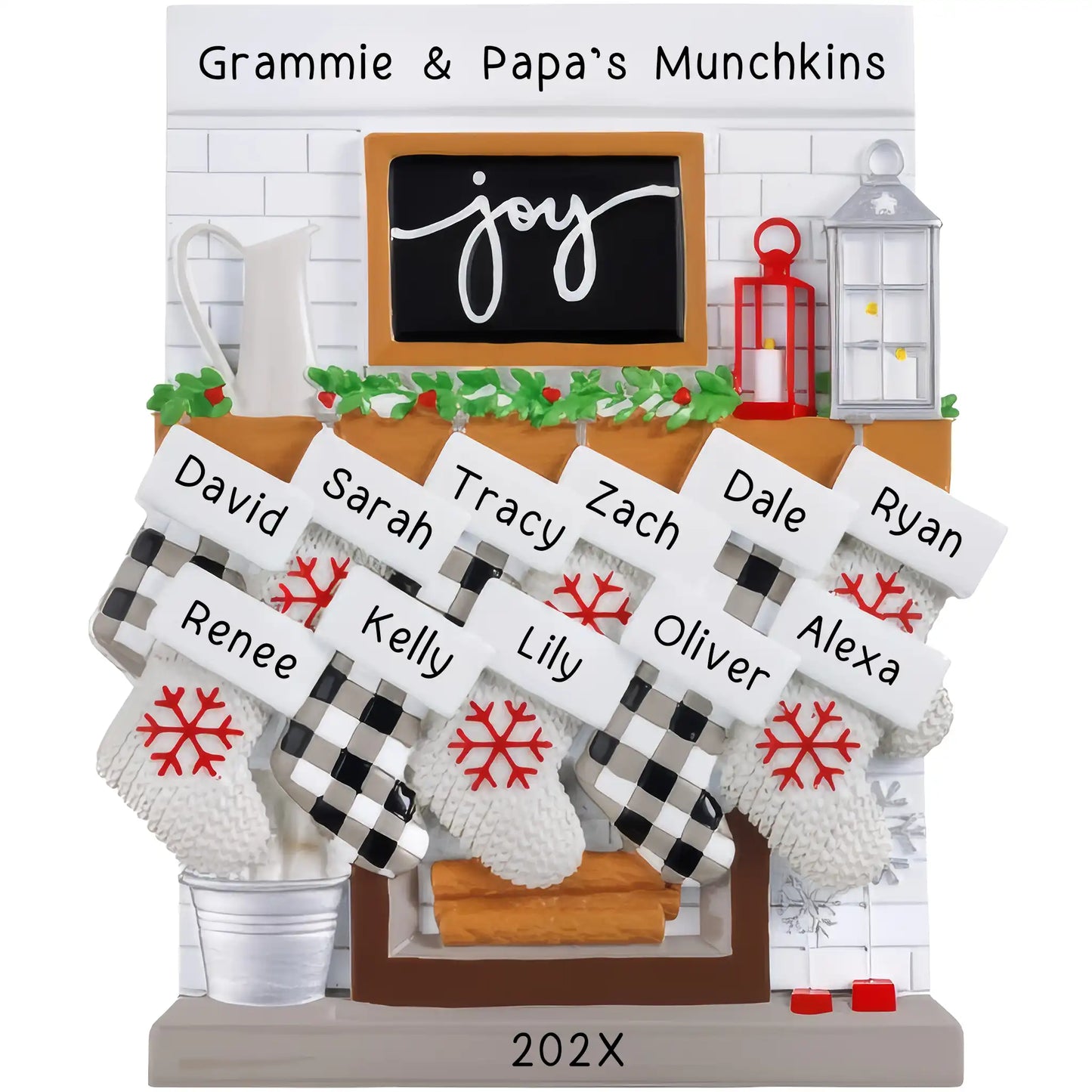 A table top fireplace mantle ornament featuring personalized stockings with names and the year, in a holiday decoration style.