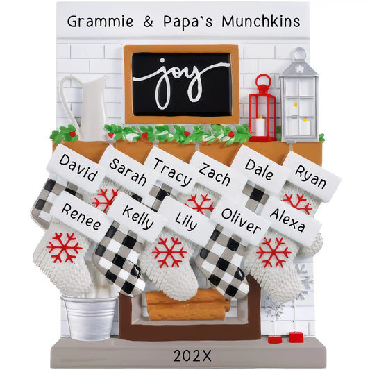 A table top fireplace mantle ornament featuring personalized stockings with names and the year, in a holiday decoration style.