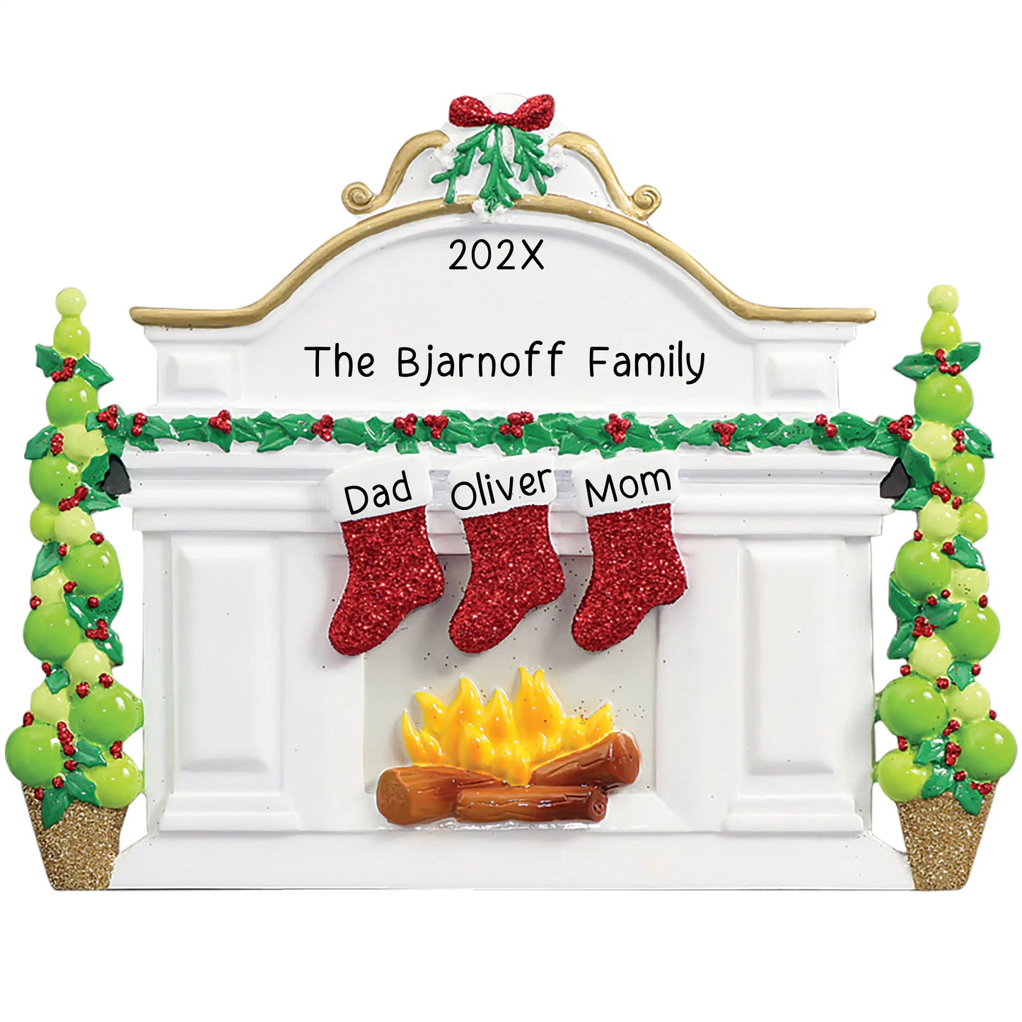 Personalized Christmas ornament featuring a white fireplace mantle with three red glitter stockings and holiday greenery, ready for three custom name engravings.