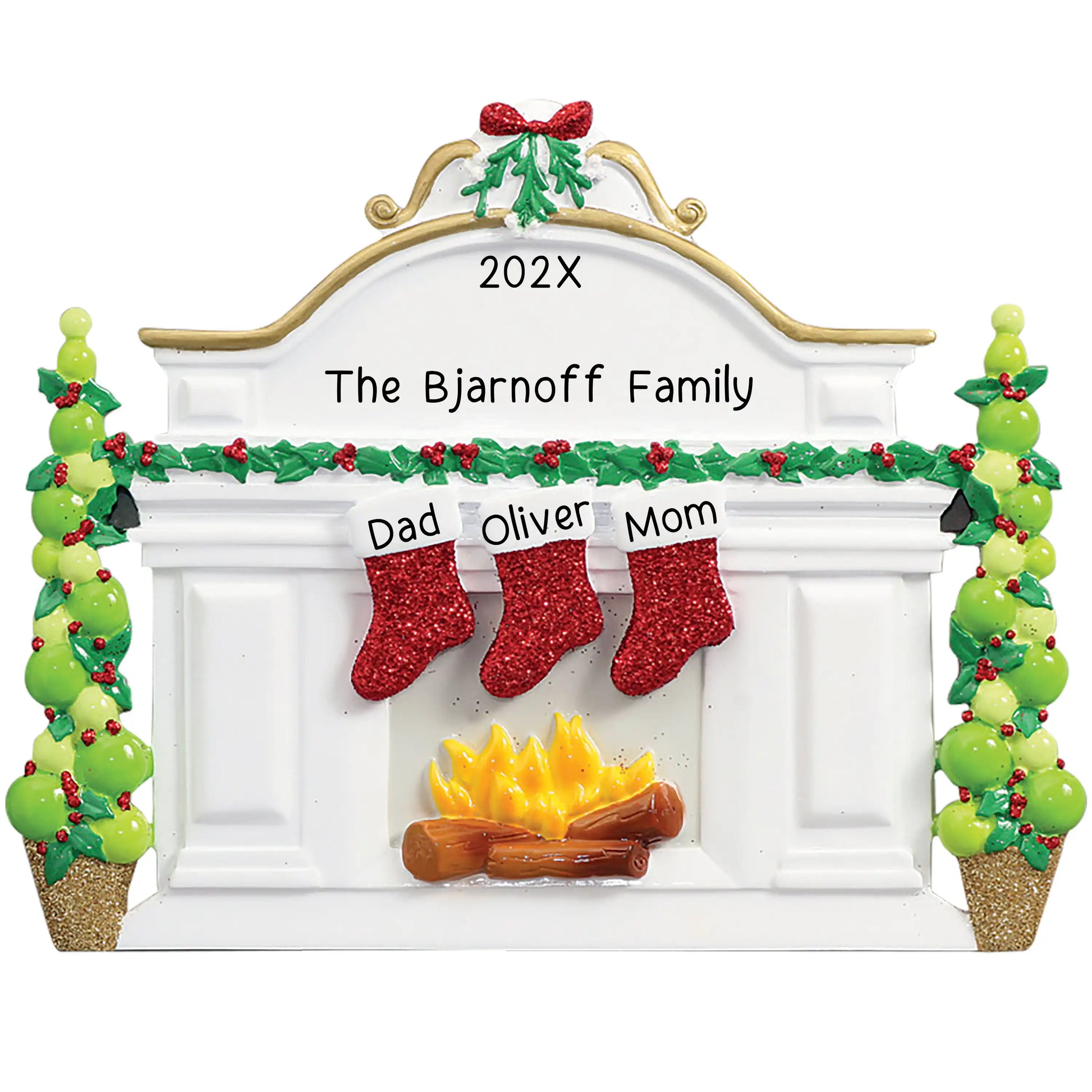 Personalized Christmas ornament featuring a white fireplace mantle with three red glitter stockings and holiday greenery, ready for three custom name engravings.