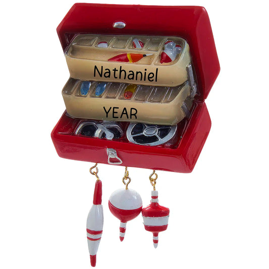 Personalized Christmas ornament shaped like an open, red fishing tackle box filled with lures, featuring three dangling red and white fishing bobbers, ready for custom engraving.