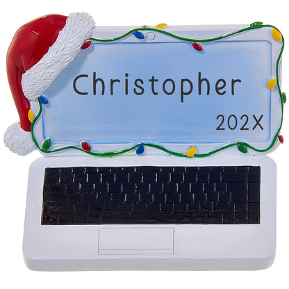 Personalized ornament with a name and year shaped like a laptop with a red santa hat and colorful christmas lights. 