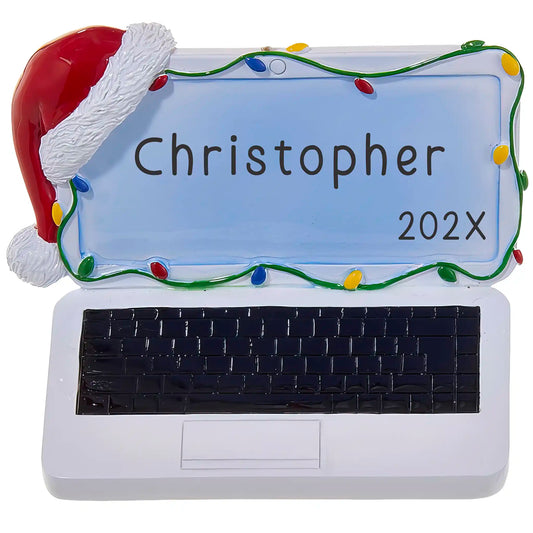 Personalized ornament with a name and year shaped like a laptop with a red santa hat and colorful christmas lights. 
