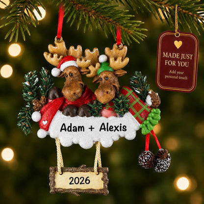 Moose couple christmas ornament hanging on a lit Christmas tree with a Made Just For You gift tag