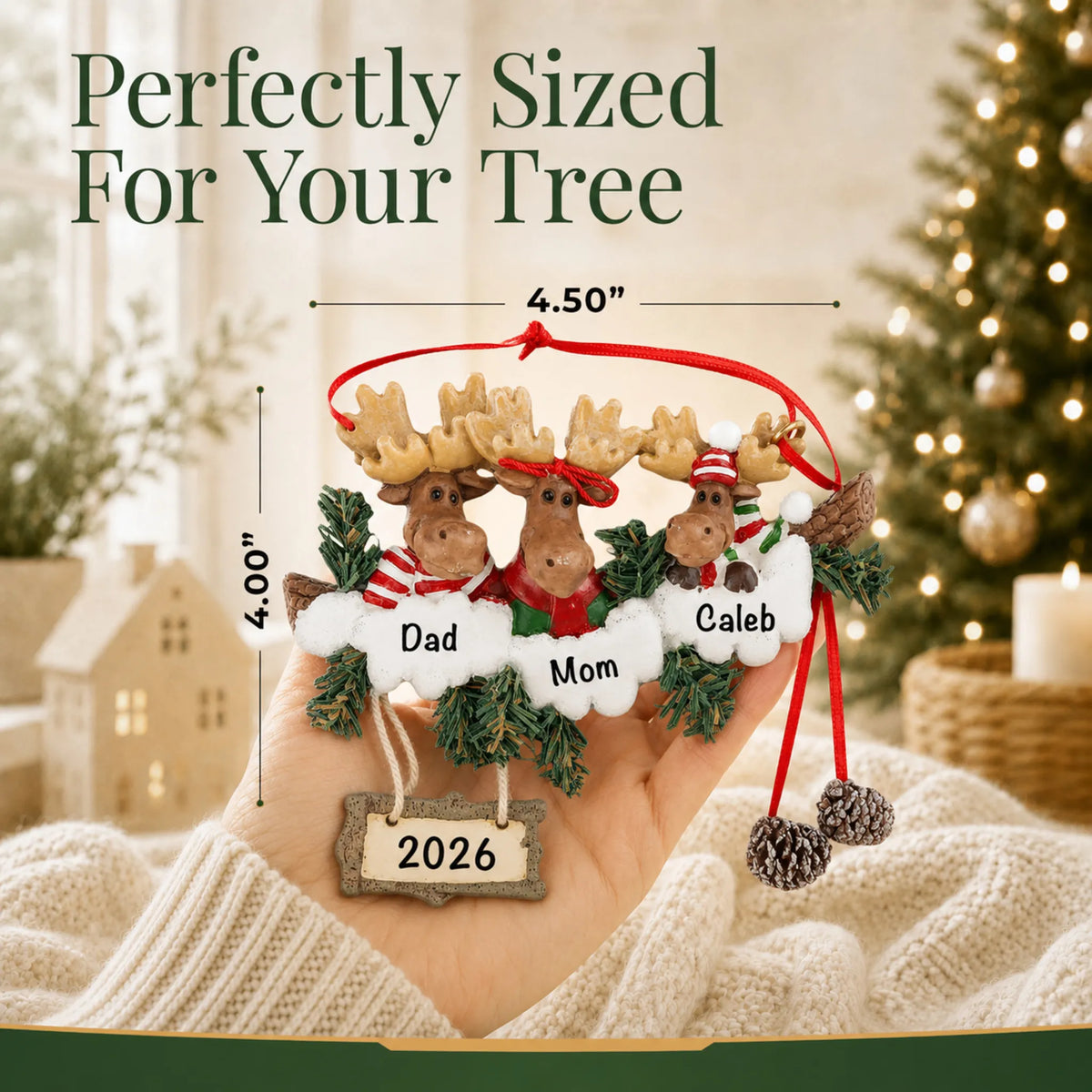 Size guide: the personalized moose family of 3 christmas ornament is 4.50 in wide by 4.00 in tall, shown in hand