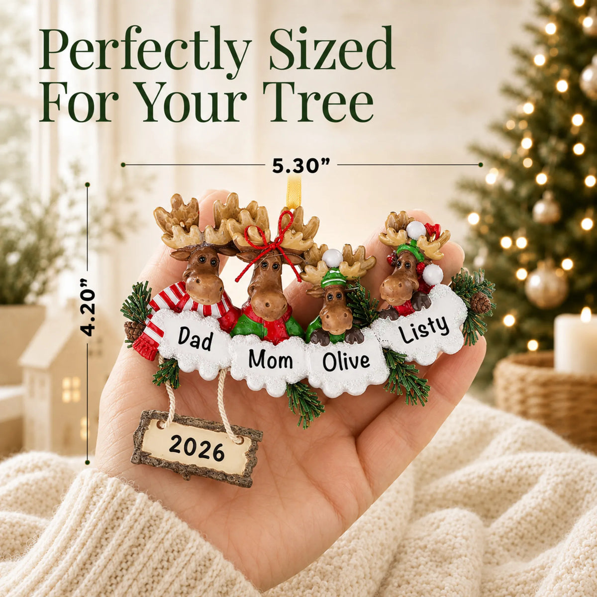 Size guide: the personalized moose family of 4 christmas ornament is 5.30 in wide by 4.20 in tall, shown in hand