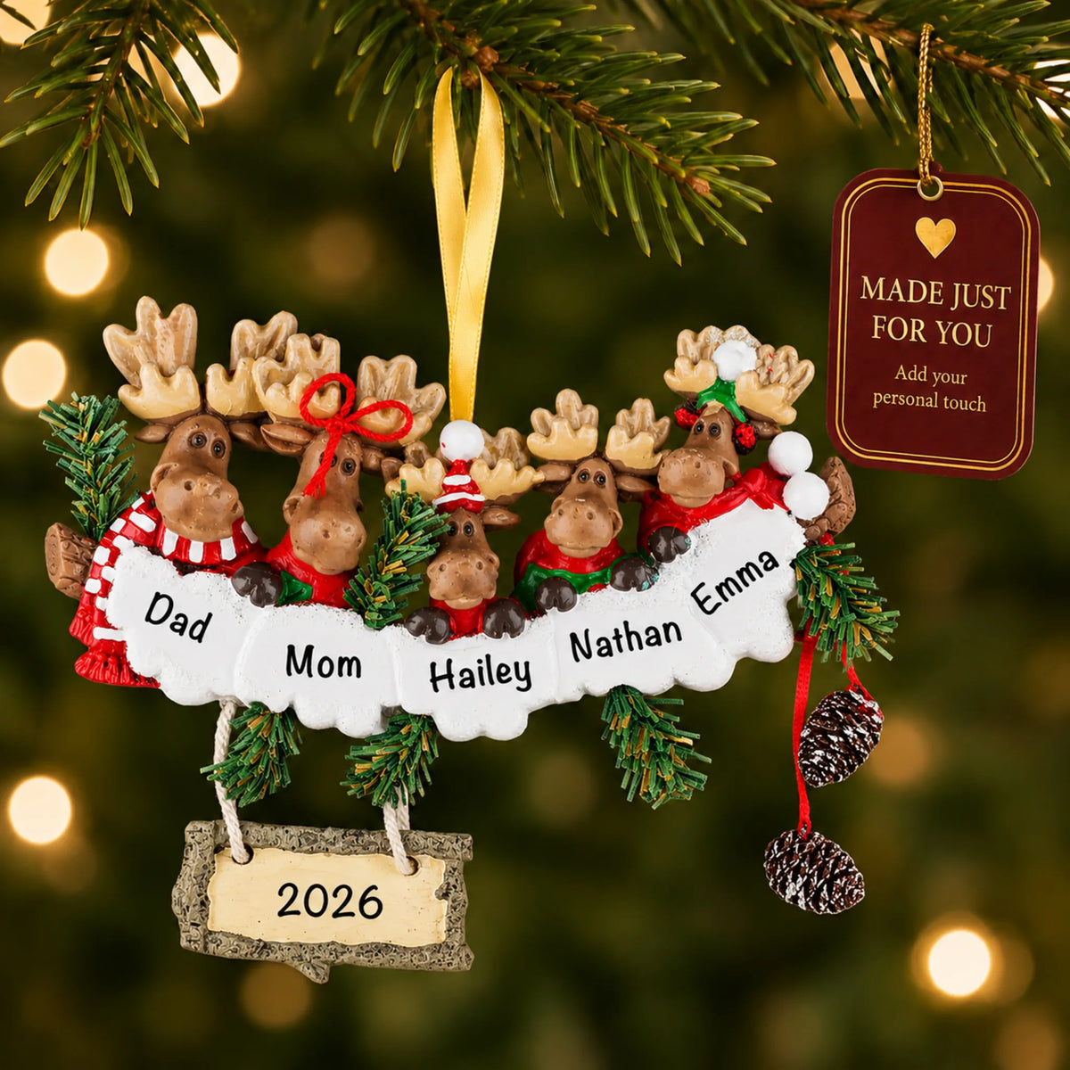 Moose family of 5 christmas ornament hanging on a lit Christmas tree with a Made Just For You gift tag
