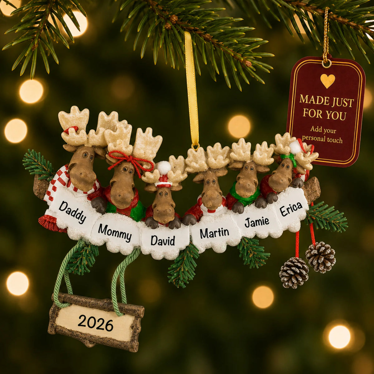 Moose family of 6 christmas ornament hanging on a lit Christmas tree with a Made Just For You gift tag