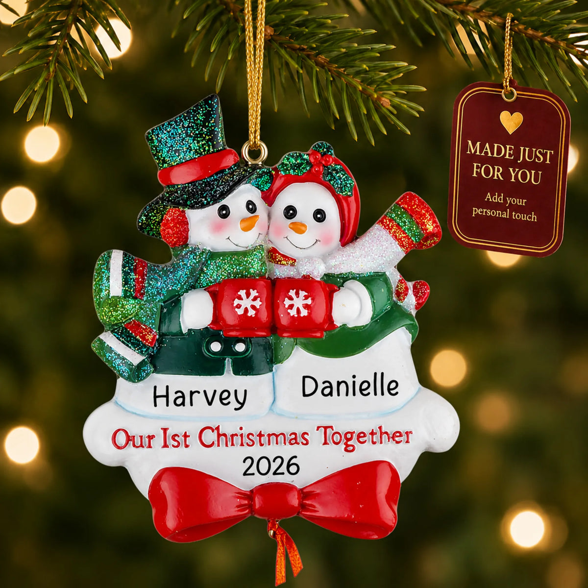 Snowman couple our 1st christmas together ornament hanging on a lit Christmas tree with a Made Just For You gift tag
