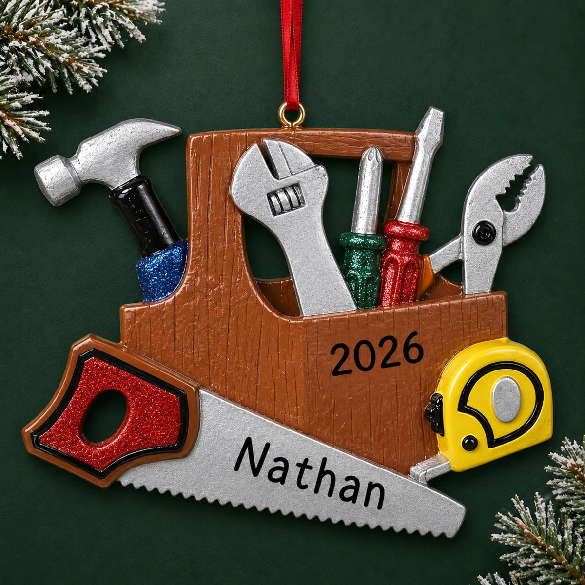 Personalized handyman christmas ornament on a dark green pine background