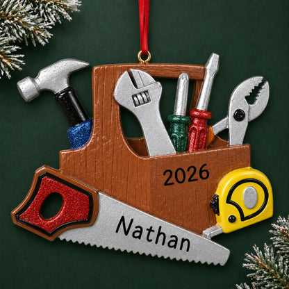 Personalized handyman christmas ornament on a dark green pine background