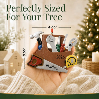 Size guide: the personalized handyman christmas ornament is 4.00 in wide by 3.00 in tall, shown in hand