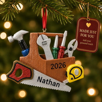 Handyman christmas ornament hanging on a lit Christmas tree with a Made Just For You gift tag