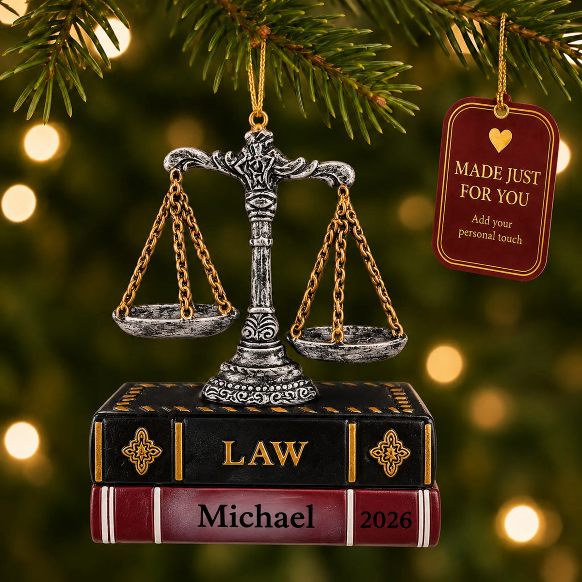 Legal scales of justice christmas ornament hanging on a lit Christmas tree with a Made Just For You gift tag