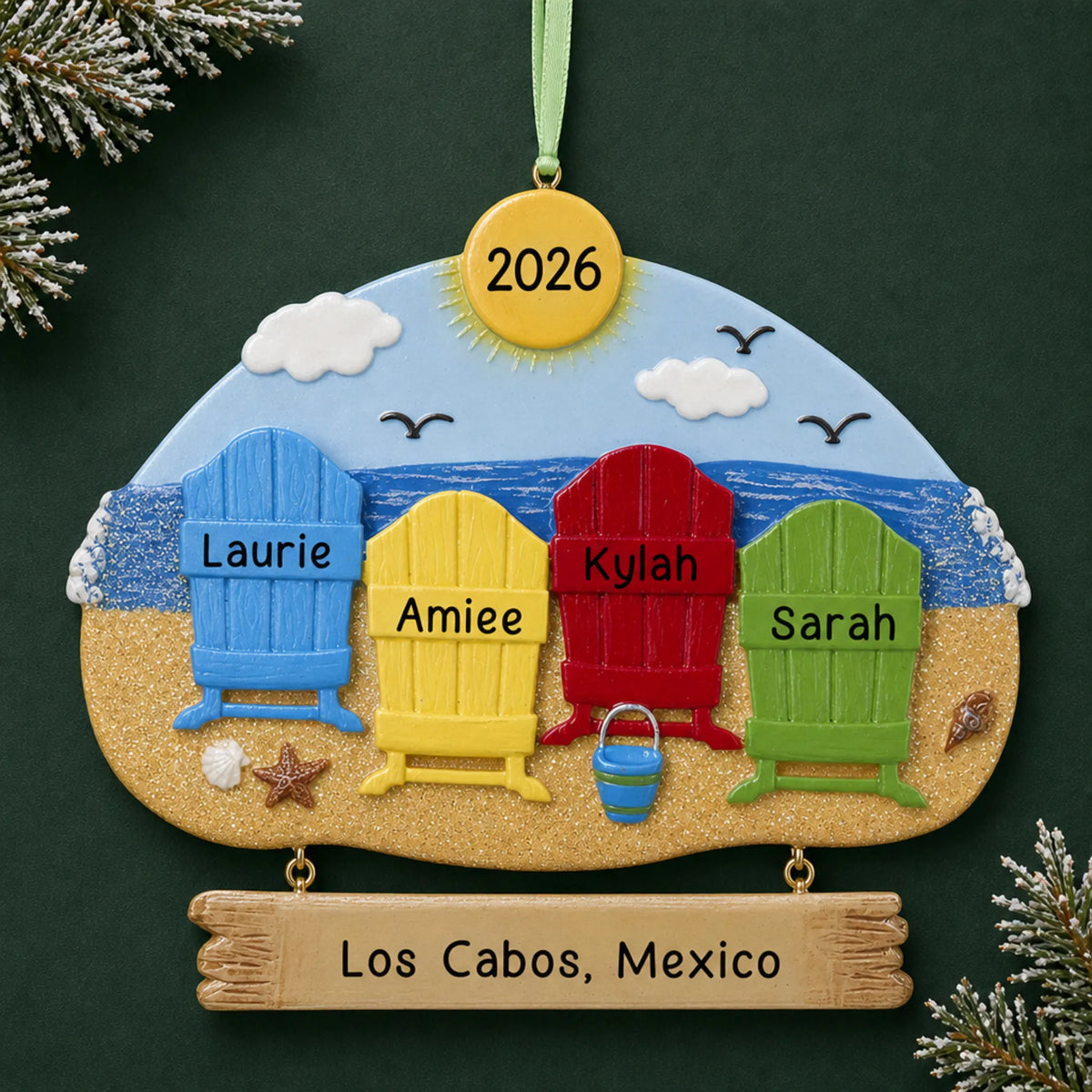Personalized beach family of 4 christmas ornament on a dark green pine background