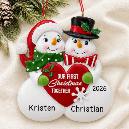 Personalized our 1st christmas together ornament laid on a soft white knit blanket