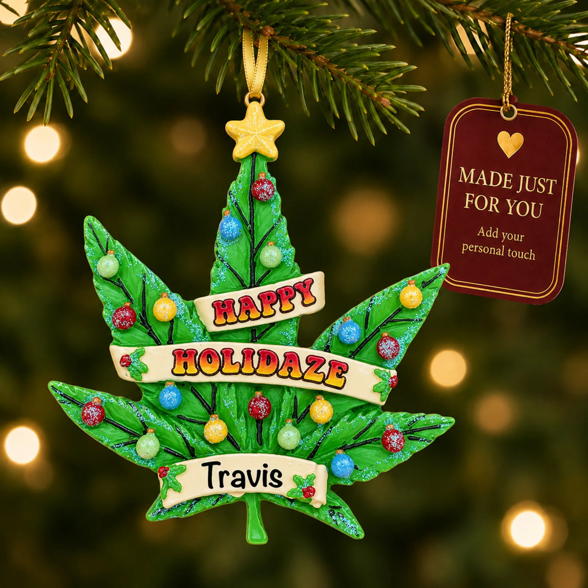 Cannabis leaf holiday tree christmas ornament hanging on a lit Christmas tree with a Made Just For You gift tag
