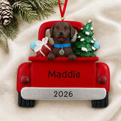 Personalized Chocolate Lab Vintage Truck christmas ornament laid on a soft white knit blanket