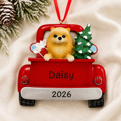 Personalized Pomeranian Vintage Truck christmas ornament laid on a soft white knit blanket