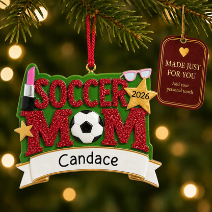 Soccer mom christmas ornament hanging on a lit Christmas tree with a Made Just For You gift tag