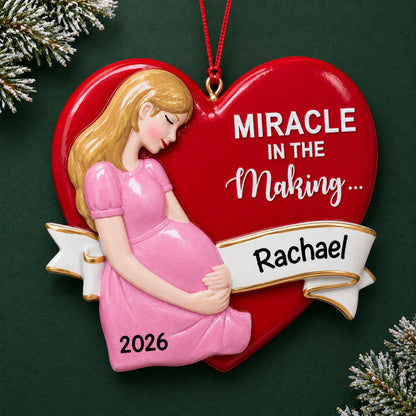 Personalized Expecting Mom christmas ornament on a dark green pine background