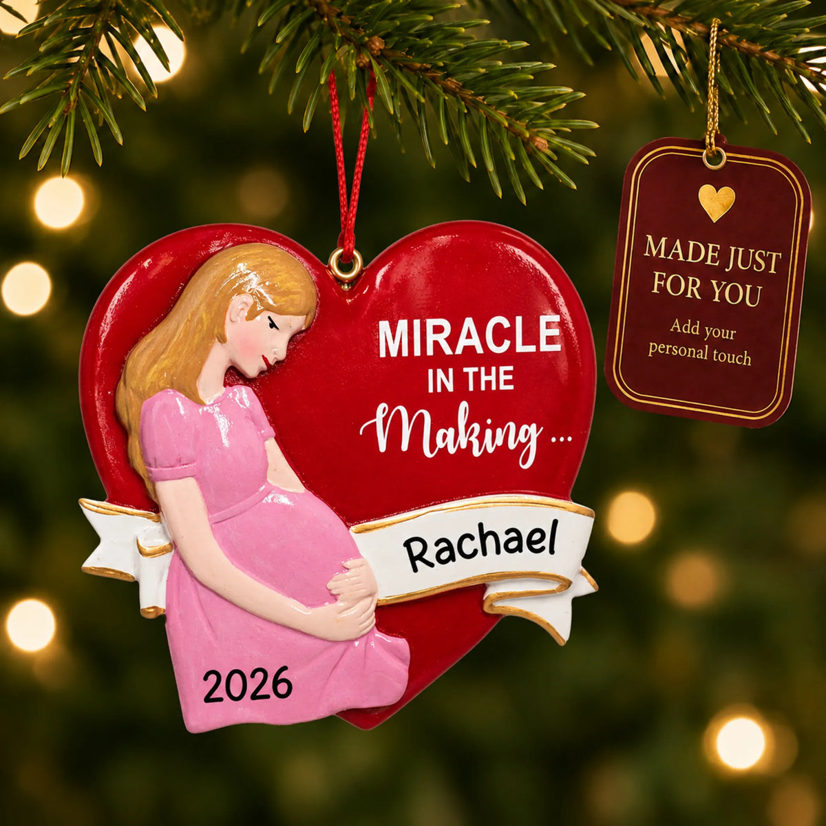 Expecting Mom christmas ornament hanging on a lit Christmas tree with a Made Just For You gift tag