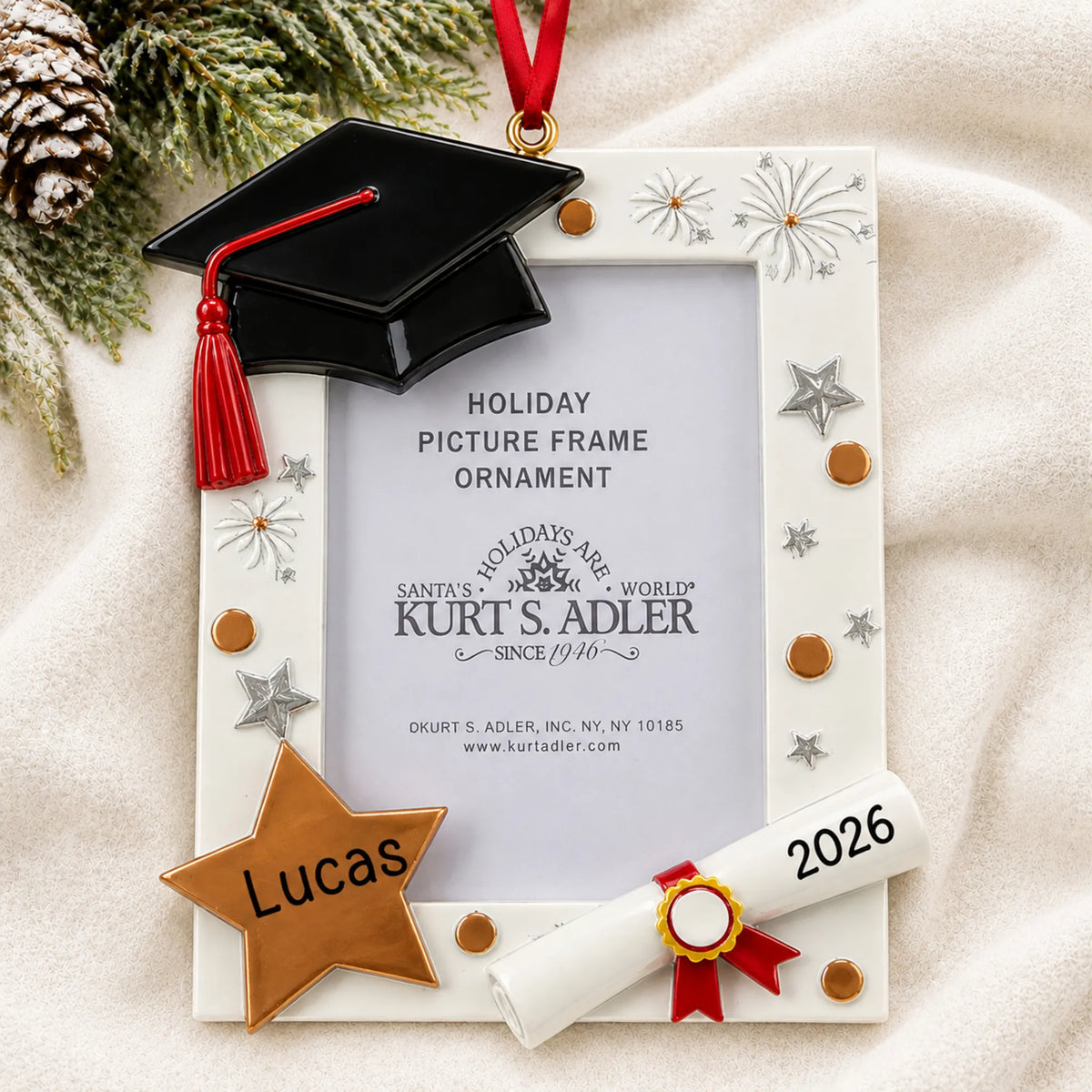 Personalized Graduation Photo Frame christmas ornament laid on a soft white knit blanket
