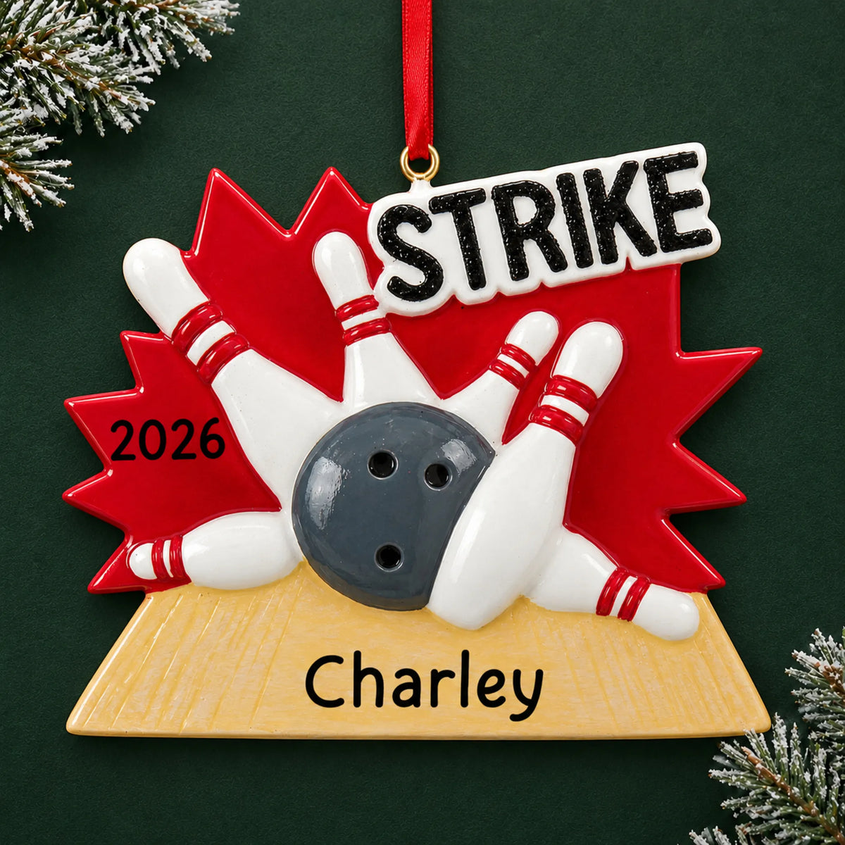 Personalized bowling strike christmas ornament on a dark green pine background