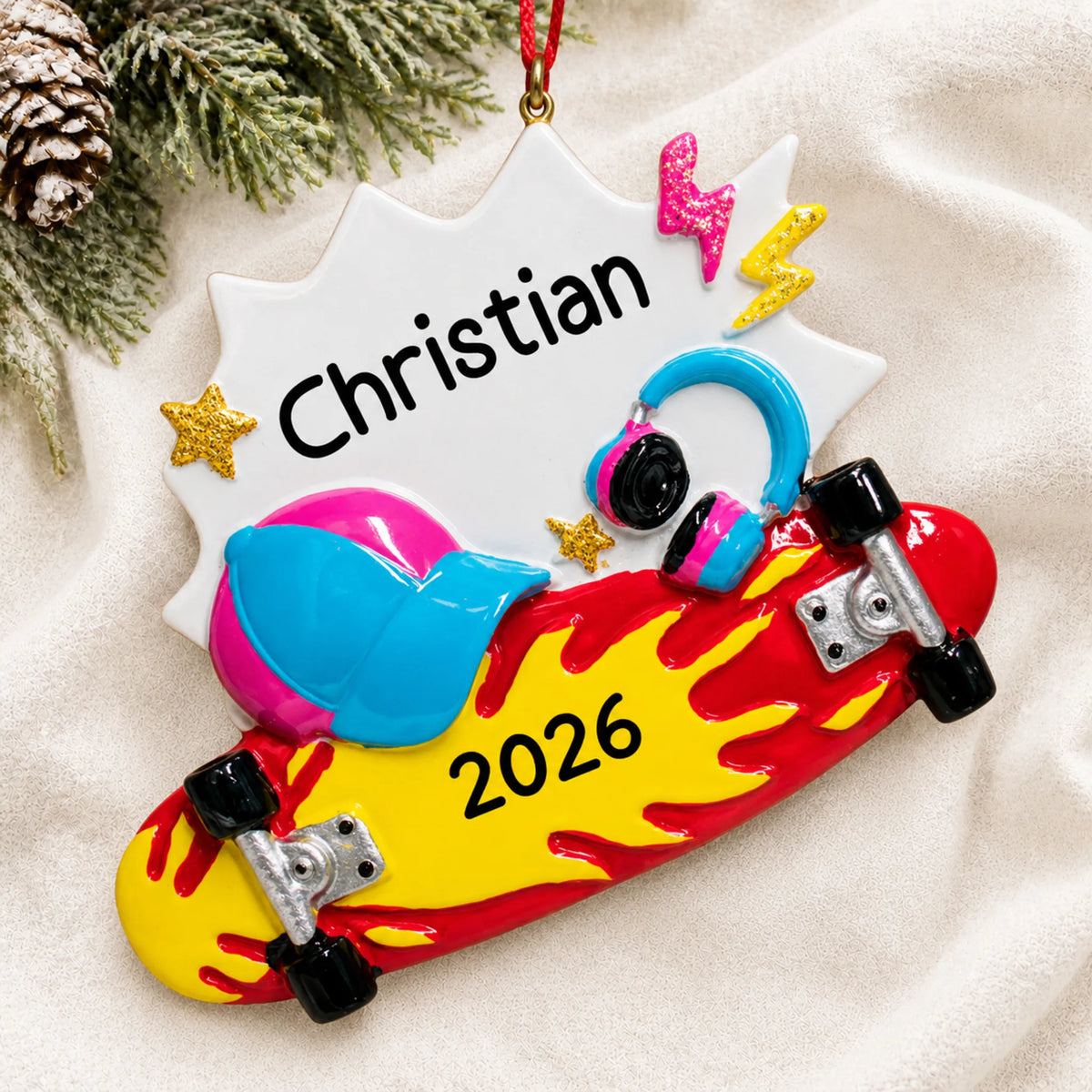 Personalized skateboard christmas ornament laid on a soft white knit blanket