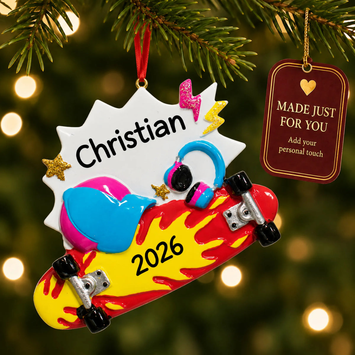 Skateboard christmas ornament hanging on a lit Christmas tree with a Made Just For You gift tag