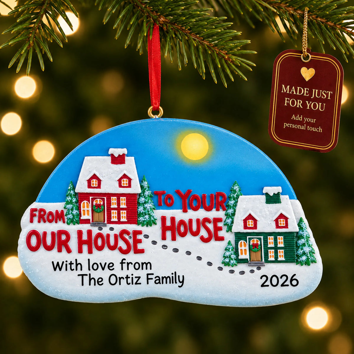 From Our House to Yours christmas ornament hanging on a lit Christmas tree with a Made Just For You gift tag