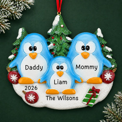 Personalized penguin family of 3 christmas ornament on a dark green pine background