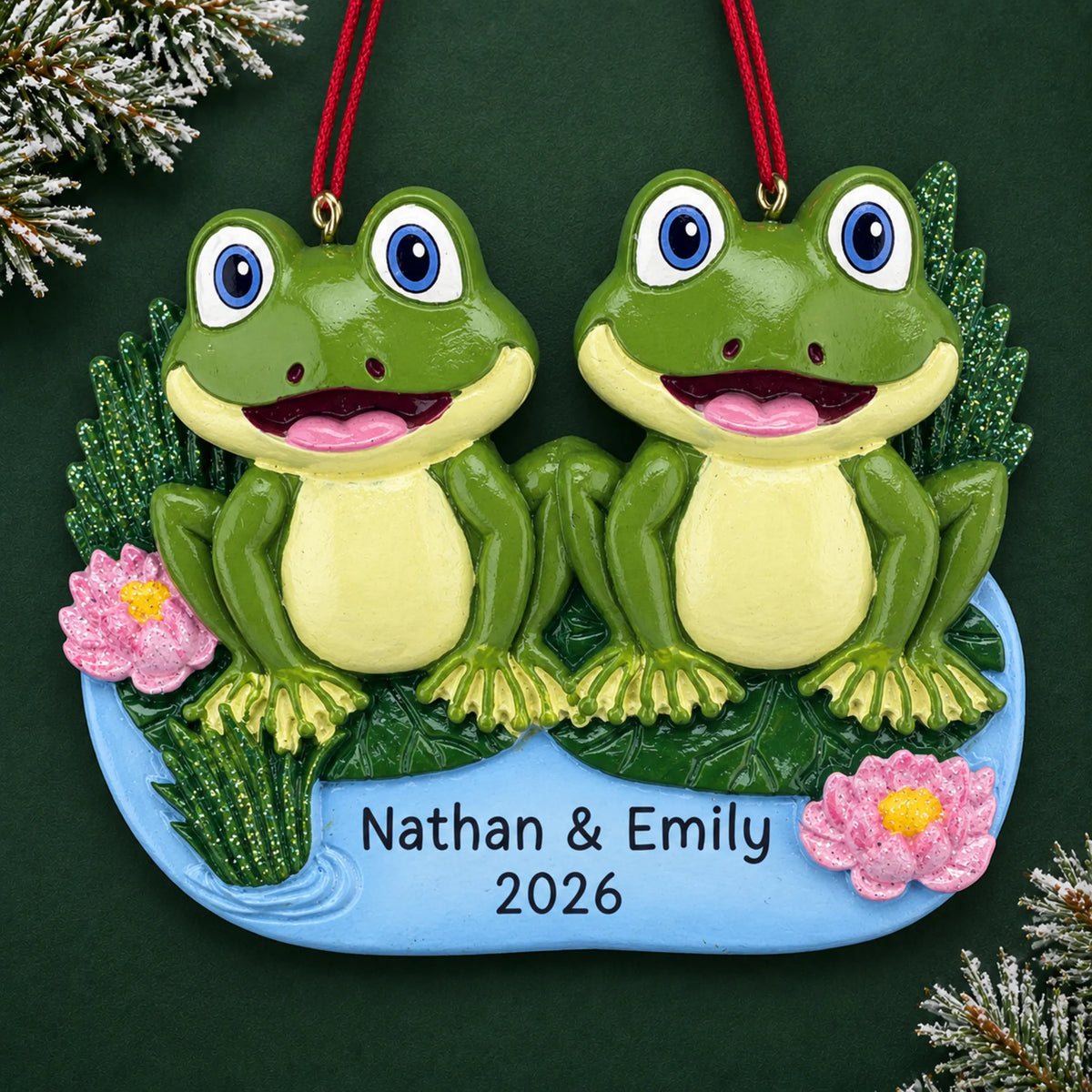 Personalized frog pond couple christmas ornament on a dark green pine background